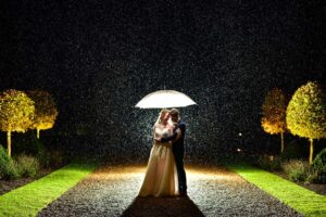 wedding photos in the rain at hales hall norfolk