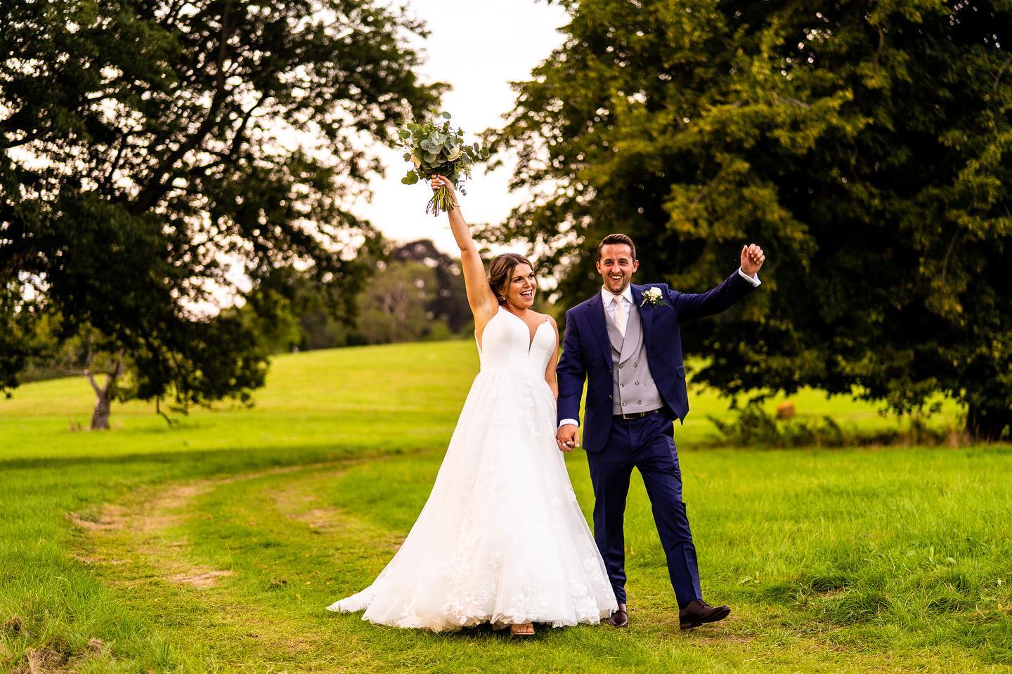 Newly weds walking at Bayfield Estate in Norfolk