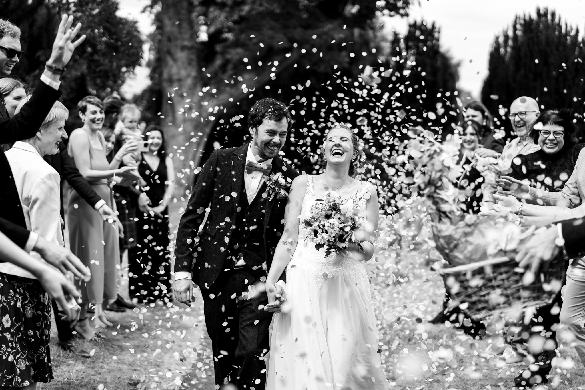 bride and groom confetti shot outside swaffham church